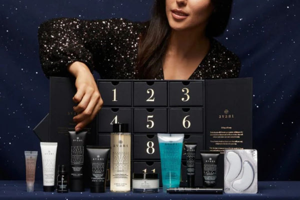 woman picking out products from the Avant Dreams Beauty Advent Calendar