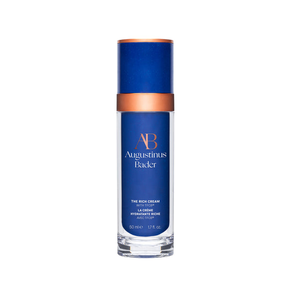 Blue skincare bottle with bronze cap on a white background
