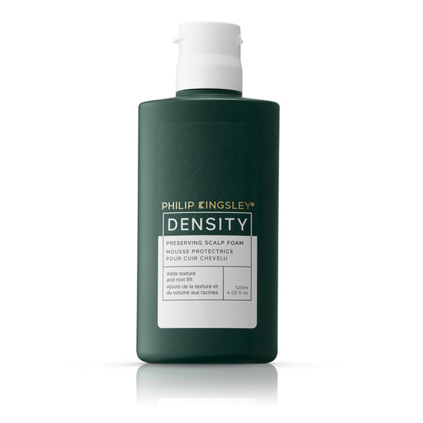 Green bottle of Philip Kingsley Density Preserving Scalp Foam on a white background