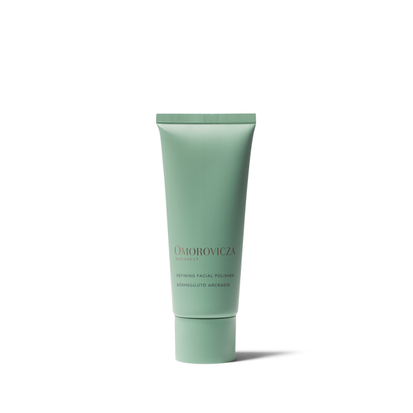 A mint green squeeze tube of Omorovicza Retinol Facial Volumizer on a clean white background.