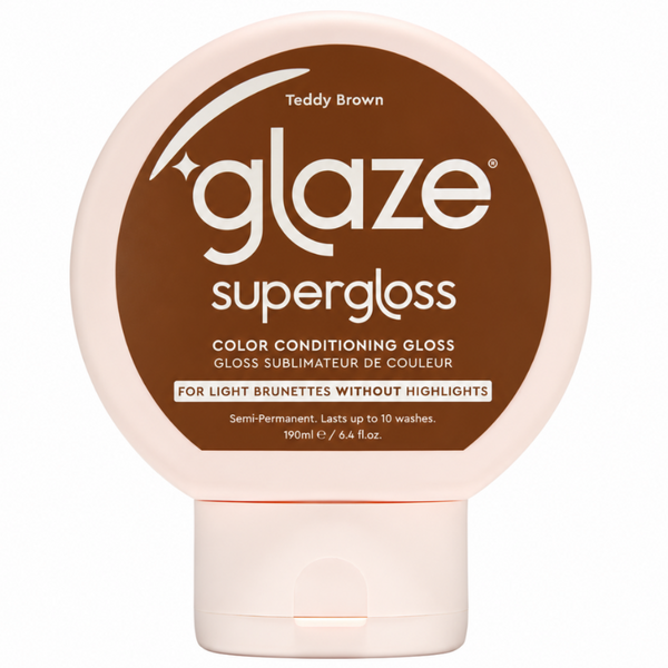 A round plastic bottle of Glaze Supergloss color conditioning gloss in the shade Teddy Brown, featuring a light pink container with a large brown label and white text.