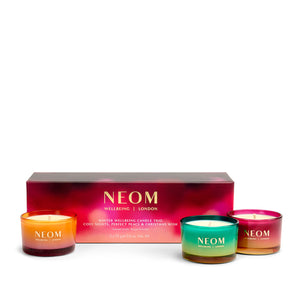 NEOM candle set with three candles and a box on a white background