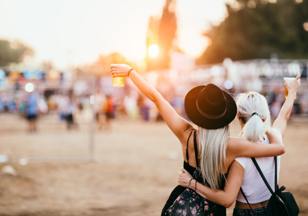 Women hugging at festival