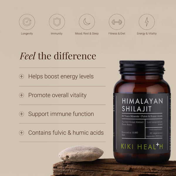 A bottle of Kiki Health Himalayan Shilajit placed on a wooden surface with a stone beside it, set against a beige background with product benefits and icons displayed on the left.