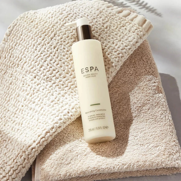 ESPA Nourishing Conditioner laid on a towel