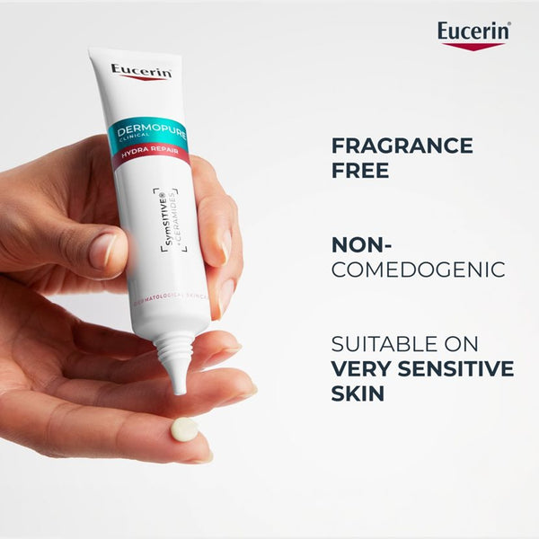 Eucerin Dermovital cream tube held in a hand with product features listed on a light gray background