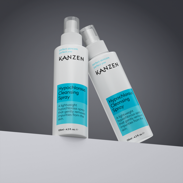 Two bottles of Kanzen Hypochlorous Cleansing Spray on a gray background