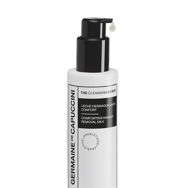 White bottle with black pump of Germaine de Capuccini makeup removal milk on a white background