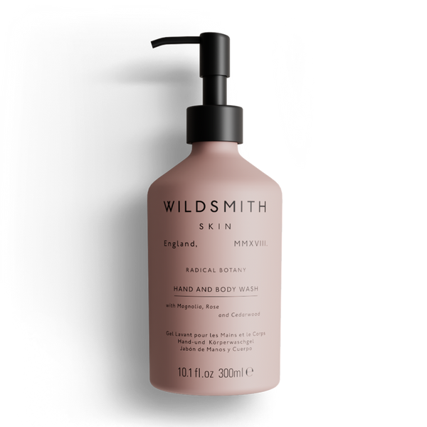 Pink bottle of Wildsmith Skin hand and body wash on a white background