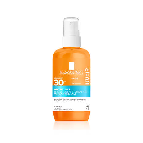 Orange bottle of La Roche-Posay UVair sunscreen mist on a white background