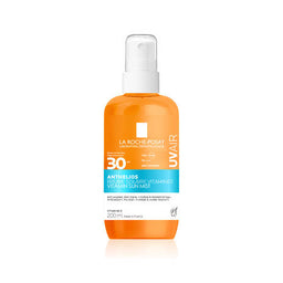 Orange bottle of La Roche-Posay UVair sunscreen mist on a white background