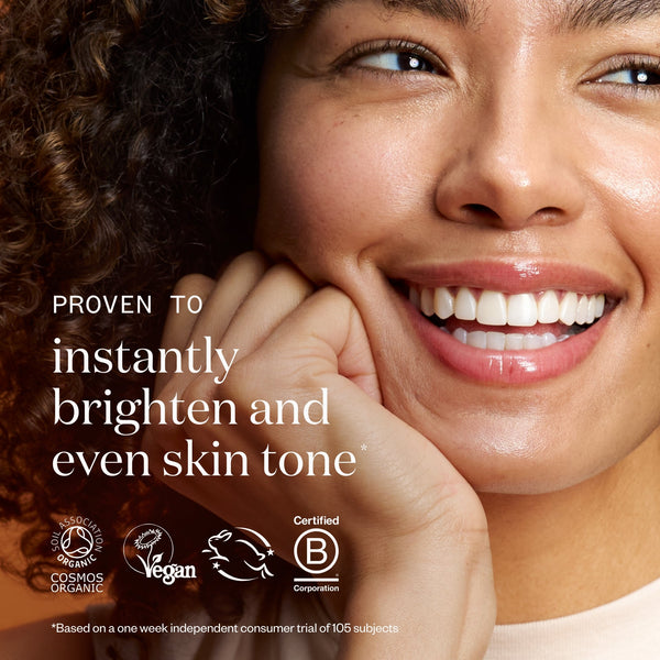 Woman with a radiant smile, text about skin tone improvement, and certification logos.