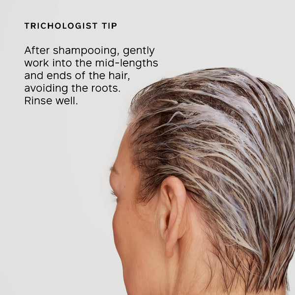Person with gray hair and trichologist tip text on a light background