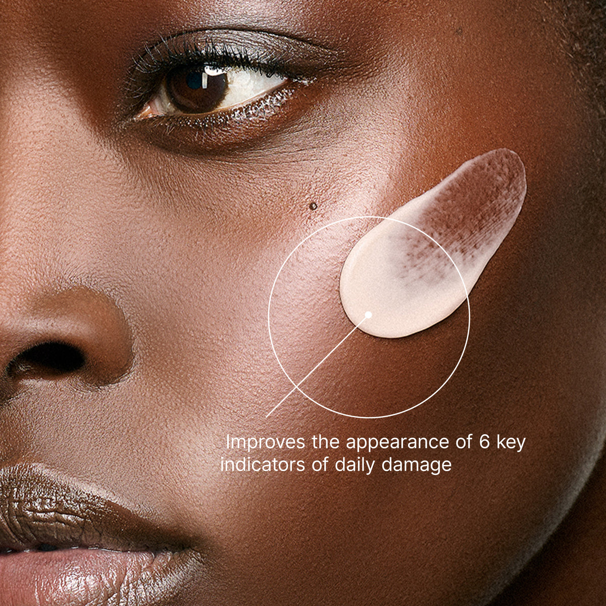 Close-up of a woman's face with a product application, highlighting skin care improvement.