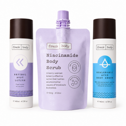 Three Frank Body skincare products on a white background: a lavender body scrub squeeze pouch in the center, flanked by a retinol body lotion bottle on the left and a hyaluronic acid body serum bottle on the right.