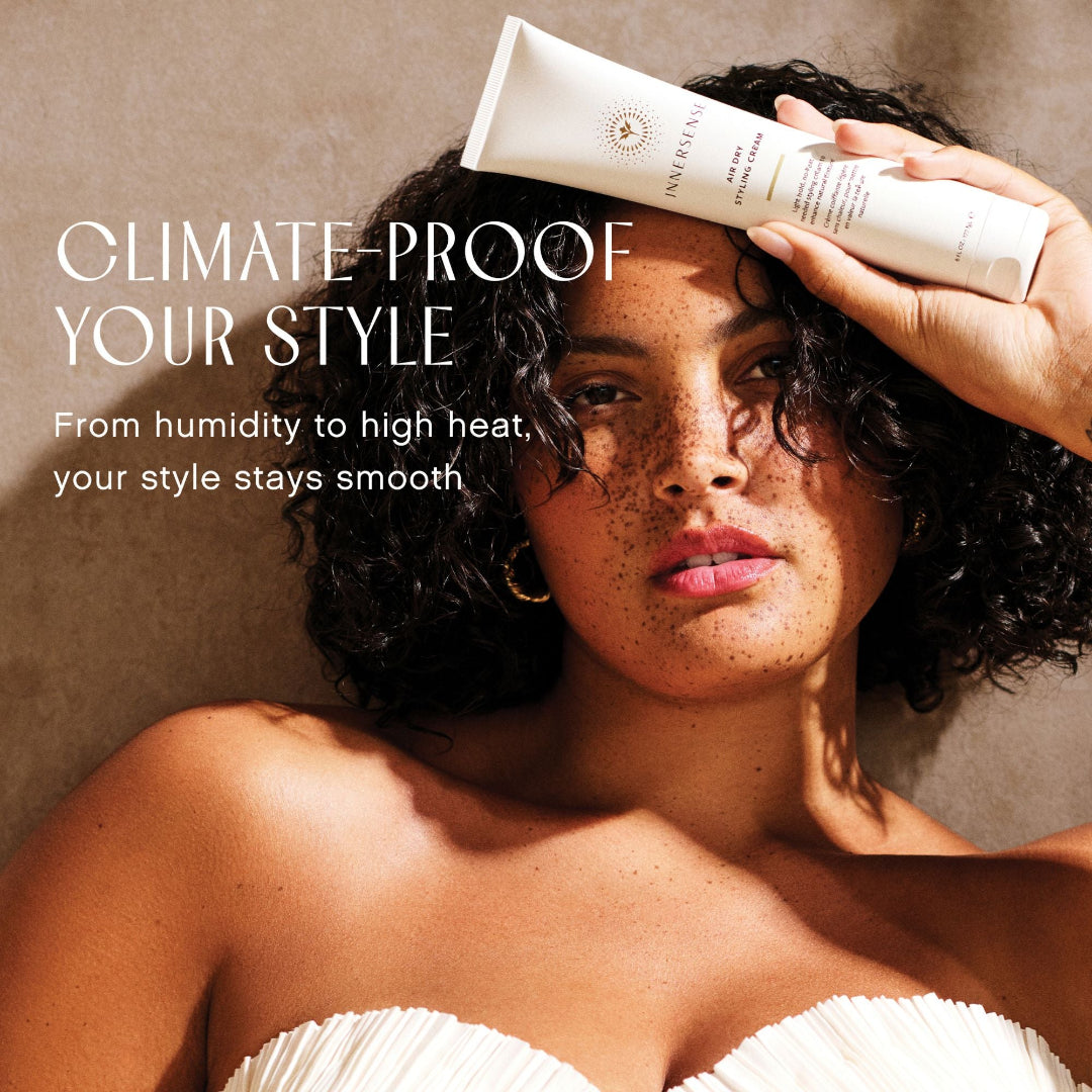 Woman holding a hair product with text about climate-proof hair style.
