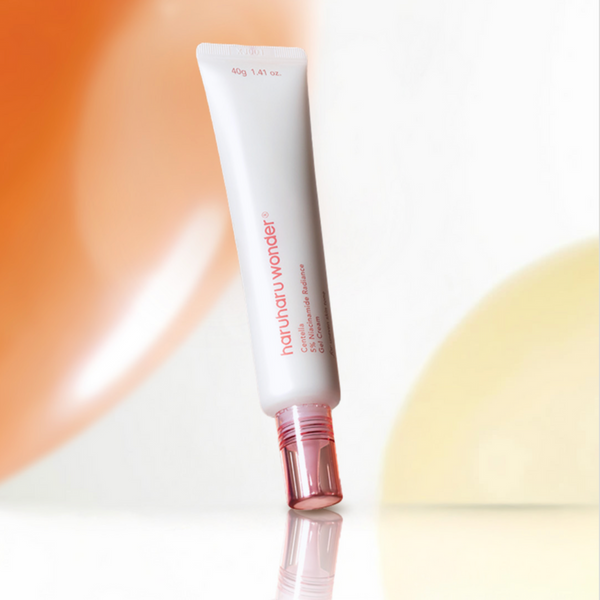 Skincare tube labeled 'Naturenatur wonder' on a gradient background