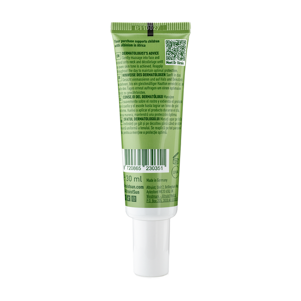 Green tube of skincare product on a white background