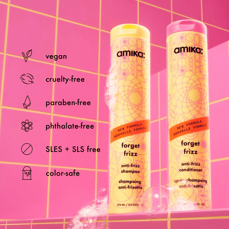 Amika 'forget frizz' shampoo and conditioner bottles on a pink background with brand information.