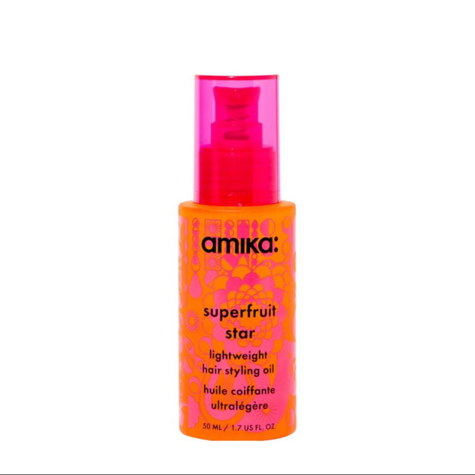 Amika Superfruit Star hair styling oil bottle on a white background