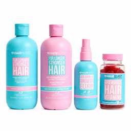 Four Hairburst hair care products in bright blue and pink packaging on a white background: a shampoo bottle, a conditioner bottle, a spray bottle, and a chewable hair vitamins bottle.