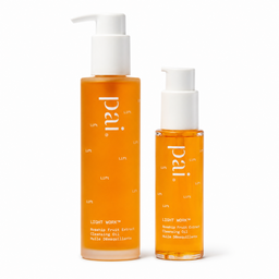 Two amber-colored skincare bottles with white pumps on a white background. The larger bottle is labeled 'pai LIGHT workcleansing Oil' and the smaller bottle is labeled 'pai LIGHT workcleansing oil facial cleansing oil'.