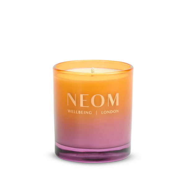 Neom candle with gradient color on a white background