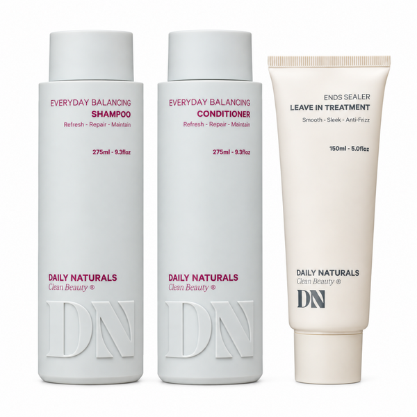 Three Daily Naturals Clear Beauty hair care products on a white background: Everyday Balancing Shampoo, Everyday Balancing Conditioner, and Ends Sealer Leave In Treatment.