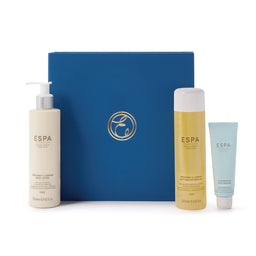 ESPA skincare products including a bottle, tube, and blue box on a white background
