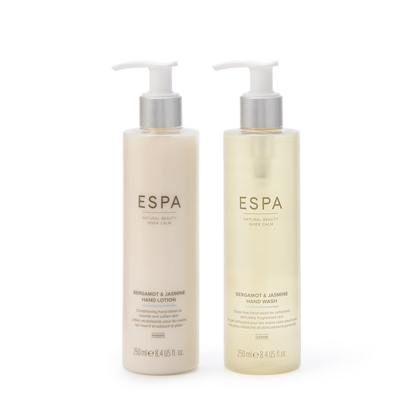 Two bottles of ESPA hand lotion on a white background