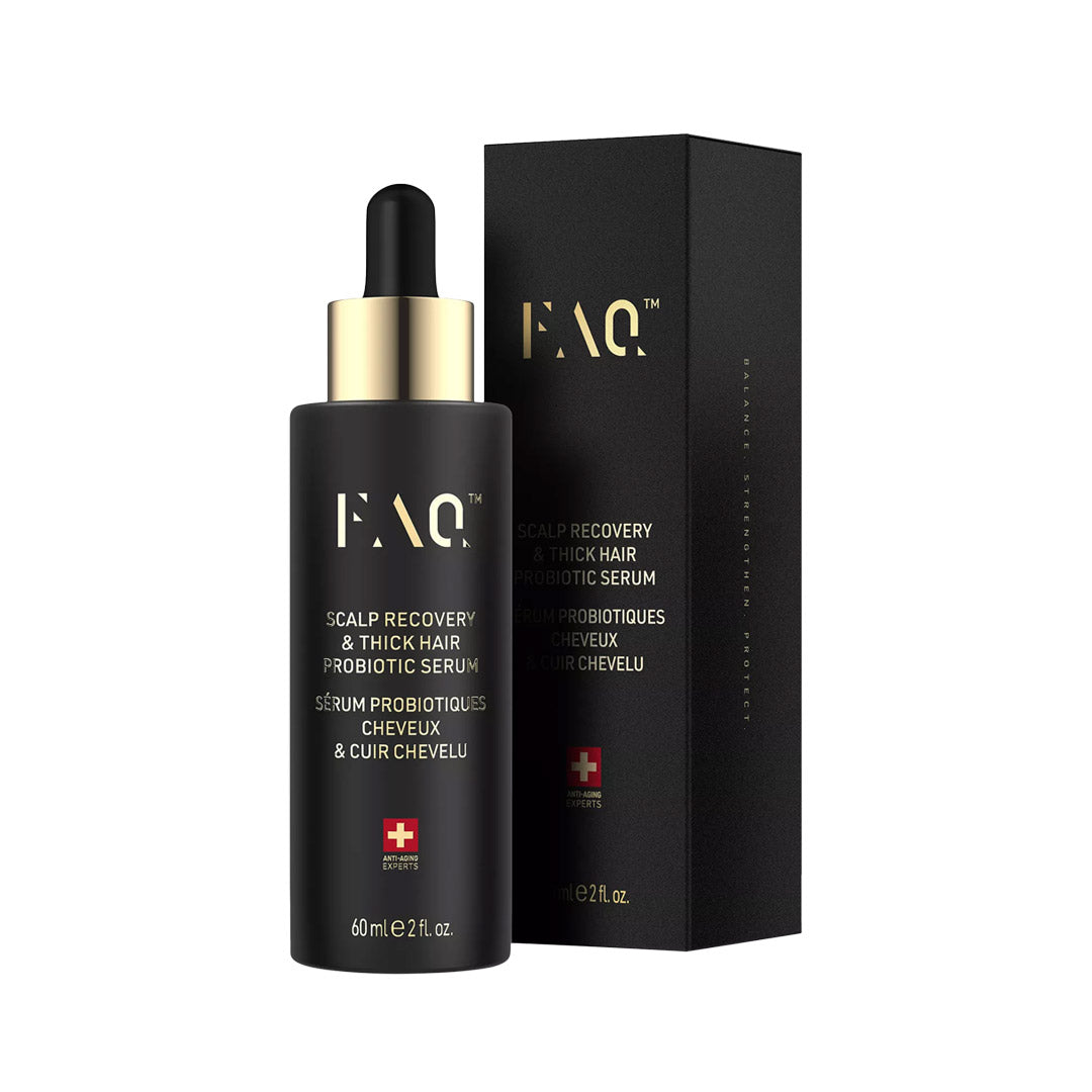Black serum bottle with dropper and packaging on a white background