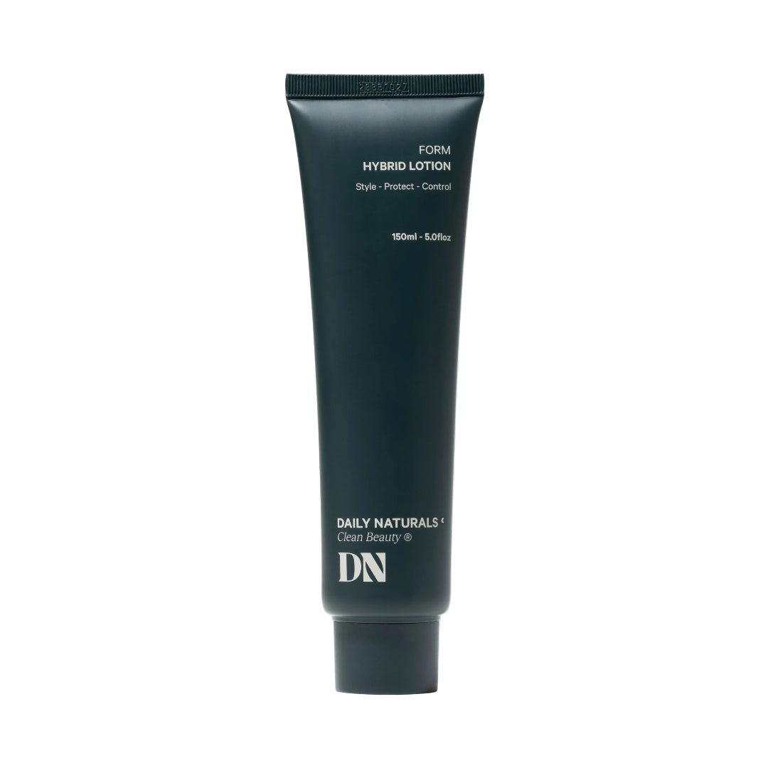 Dark green tube of 'Daily Naturals' hybrid lotion on a white background