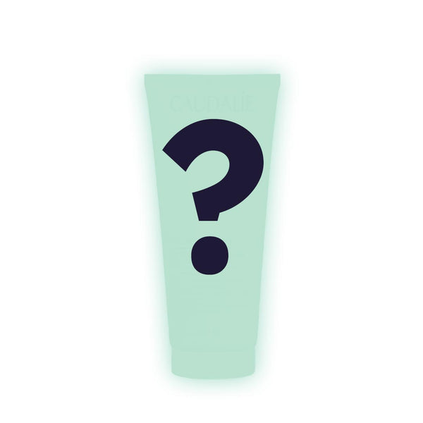 Light green tube with a black question mark on a white background