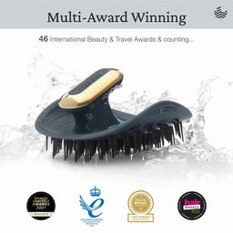 A black and gold hairbrush with black bristles, shown against a white background with water splash graphics. The image includes marketing text reading 'Multi-Award Winning' and award seals along the bottom.