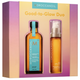 Moroccanoil Good-to-Glow Duo set in packaging with two bottles and a purple gradient background.