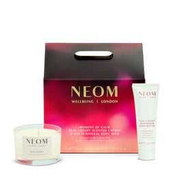 NEOM Wellbeing London candle, body milk, and body butter set on a white background