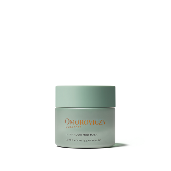A single jar of Omorovicza Budapest Ultramoor Mud Mask in a matte sage green container with gold lettering, centered on a clean white background.