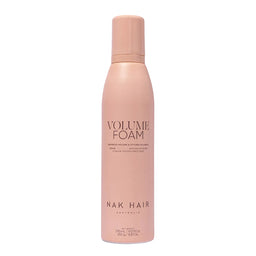 Pink bottle of NAK Hair Volume Foam on a white background
