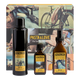 A boxed fragrance gift set from eluvos featuring three dark glass bottles with yellow labels in front of a decorative box. The set includes a tall matte black bottle, a smaller dark amber bottle, and a larger amber spray bottle.