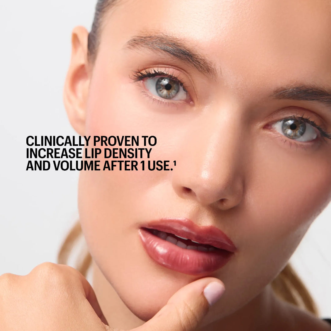 Close-up beauty ad showing a woman with glossy nude lips and text reading 'Model is wearing Shade Utopia' and 'Clinically proven to increase lip density and volume after 1 use.'.