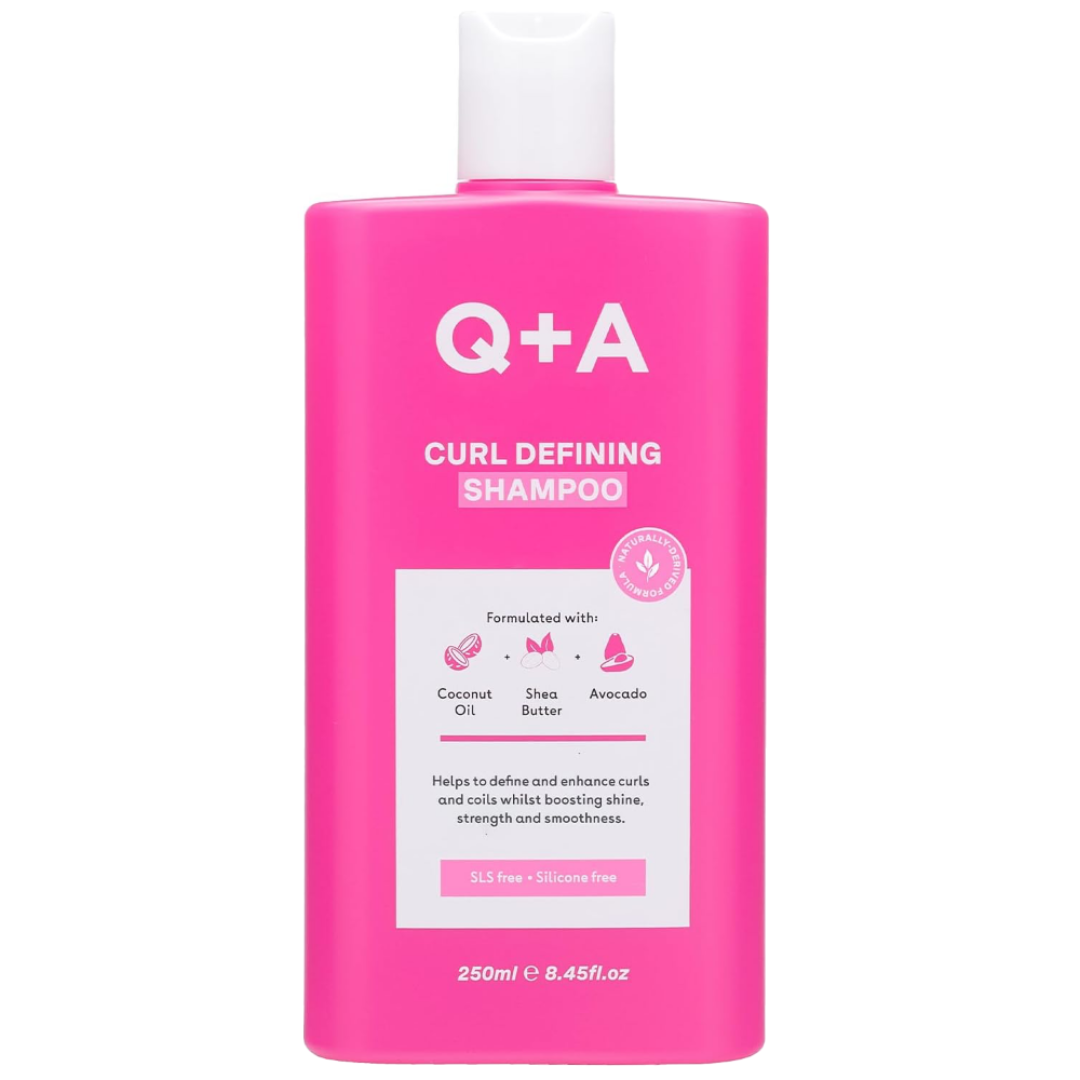 Pink bottle of Q+A Curl Defining Shampoo on a white background