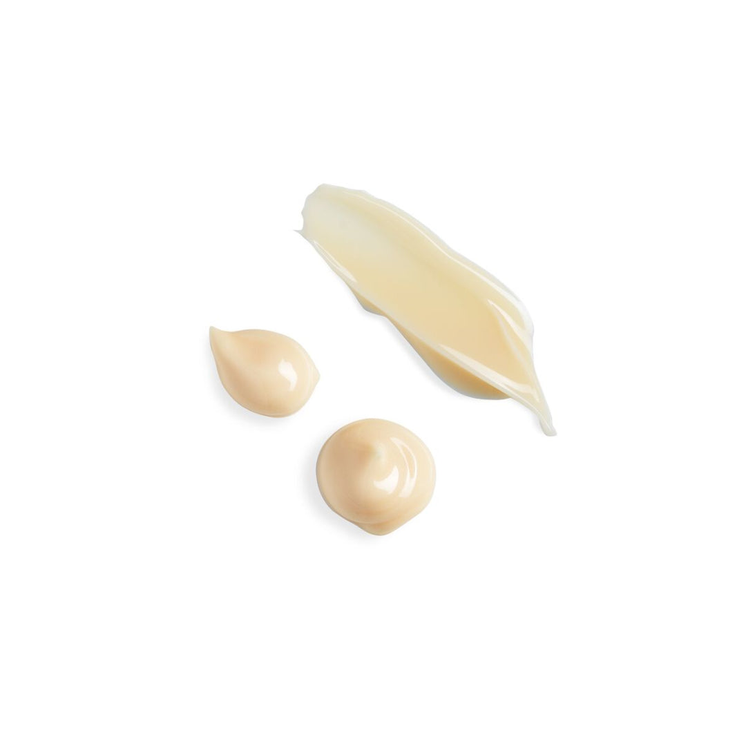 Three droplets of cream on a white background