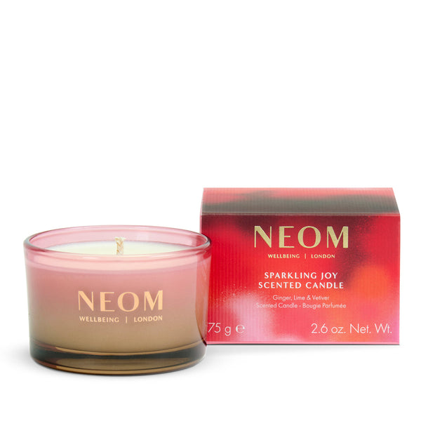 Neom scented candle with packaging on a white background