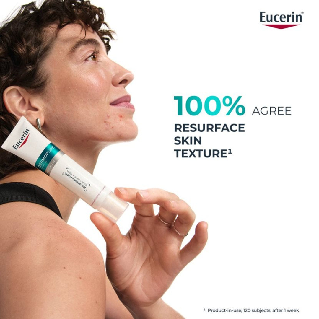Woman holding Eucerin cream with product description on a white background