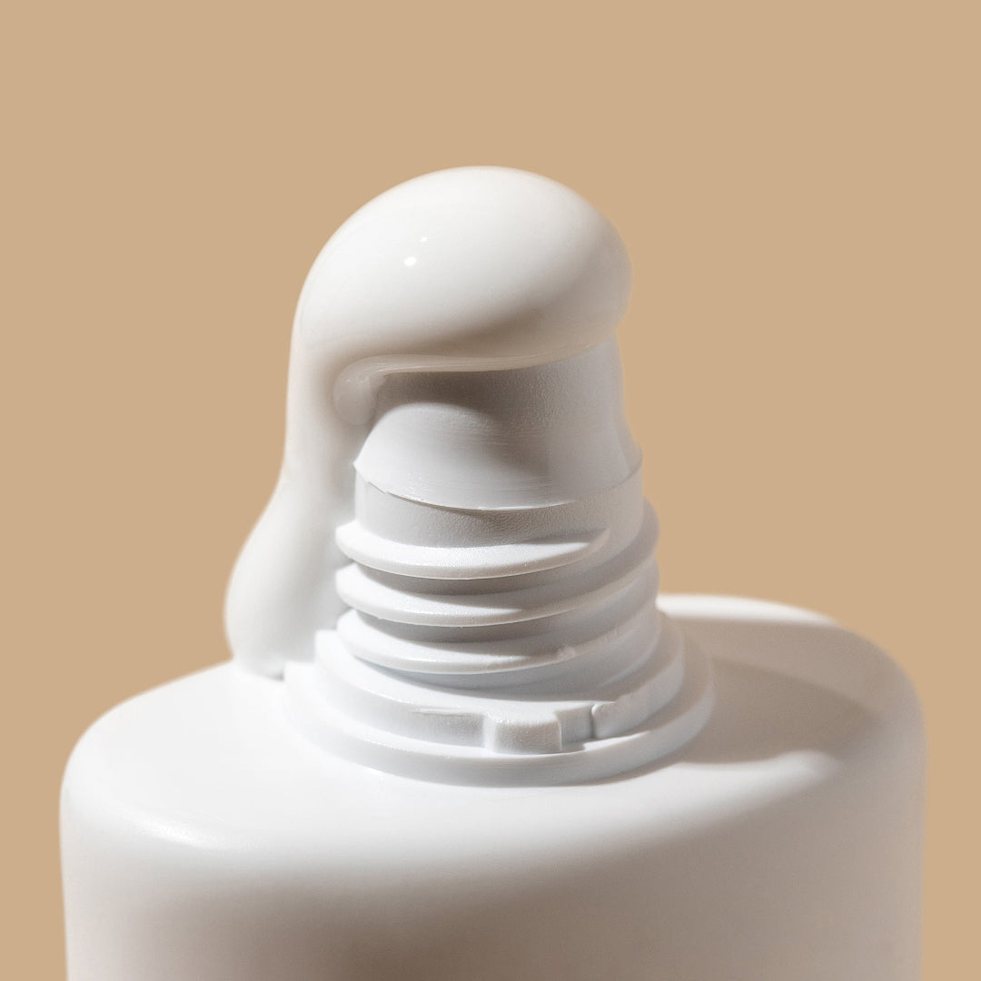 Close-up of a white bottle cap on a beige background