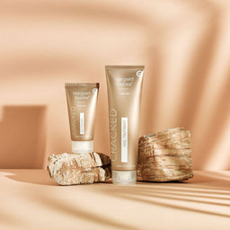 Two tubes of Margaret Dabbs Cracked heel treatment on a beige background with stone-like textures.
