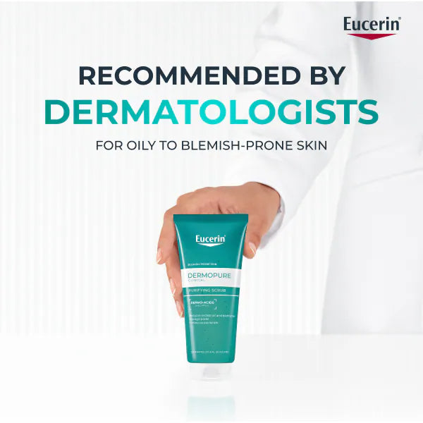 Eucerin Dermopure scrub held by a hand with a white background