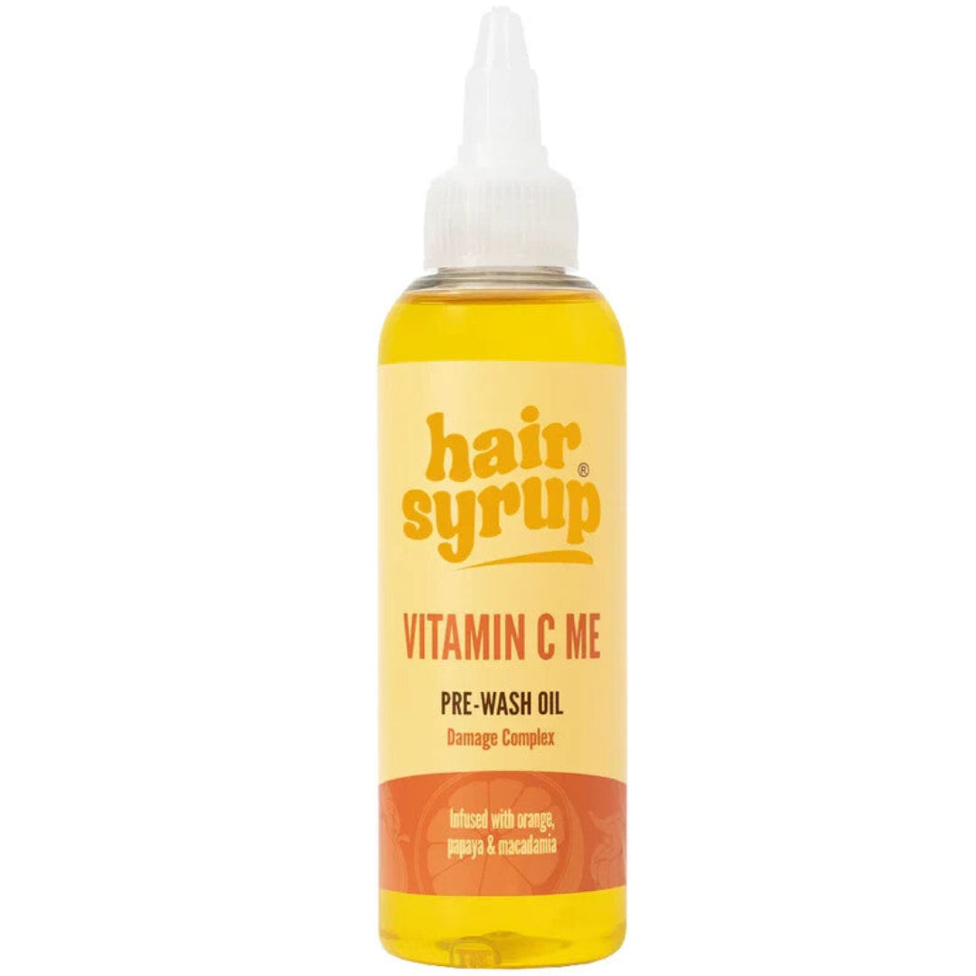 Bottle of hair syrup Vitamin C Me pre-wash oil on a white background