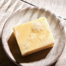 Christophe Robin Hydrating Shampoo Bar on a dish