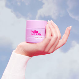 Hello Sunday The Recovery One Glow Face Mask held to the air 